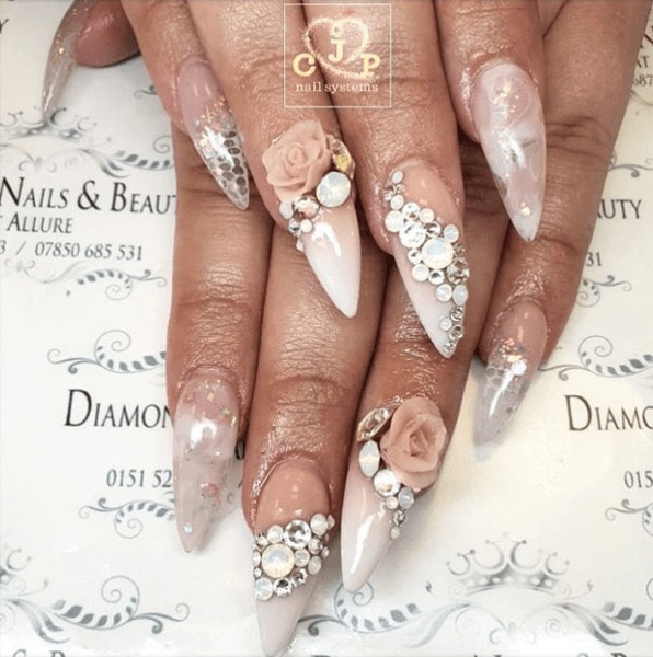 A variety of techniques and art additions combine to create this look by @diamond_nails_beauty