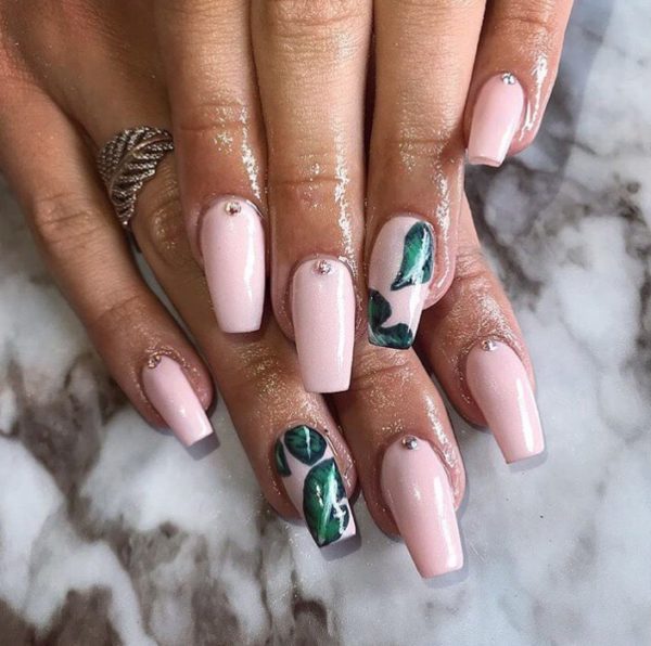 Fresh pink hue complete with leaf motif by @polishedbyellie