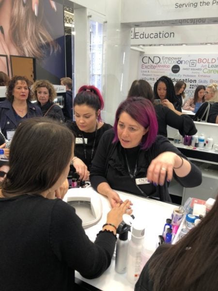 Education ambassador, Liza Smith answers questions on the Sweet Squared stand 