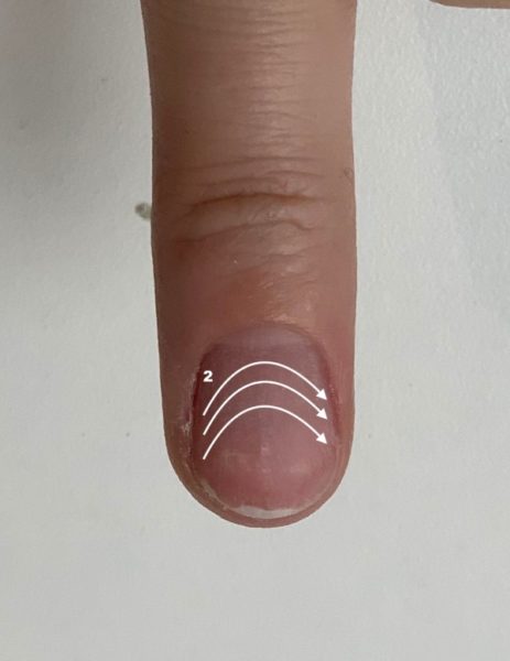 Step 2: File across the nail from one side to the other, moving to the free edge.