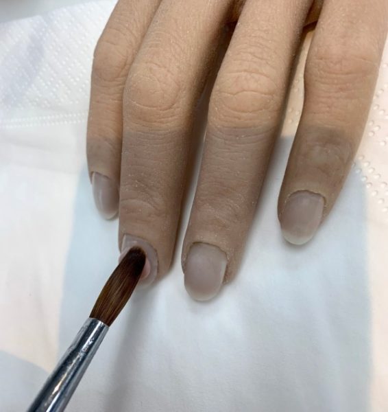When you first apply a bead, it is important to use the tip of your brush at a 45-degree angle to walk to bead from side to side, so the product seamlessly blends to the natural nail.  This is also the angle you must work when applying the cuticle bead, so you do not press it into the skin.