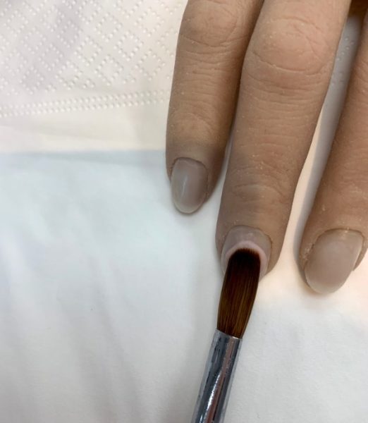 If you hold your brush flat on your first bead, you will just squash the bead, leaving a lip around the outside, which will cause lifting and potentially leading to the product touching the skin.