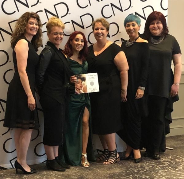 Elissa Newton-Smalls collects her Polished award