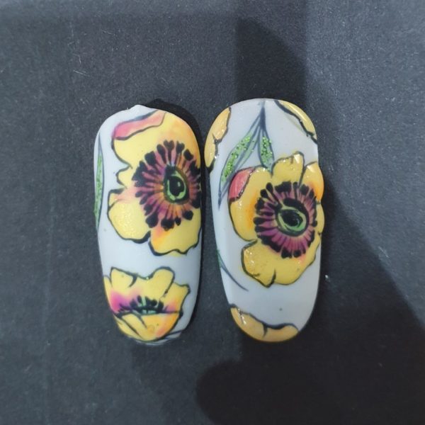 Step 4: Draw leaves and add some green Lecenté glitter and cure. Cover all nail tips with matte top coat and cure.