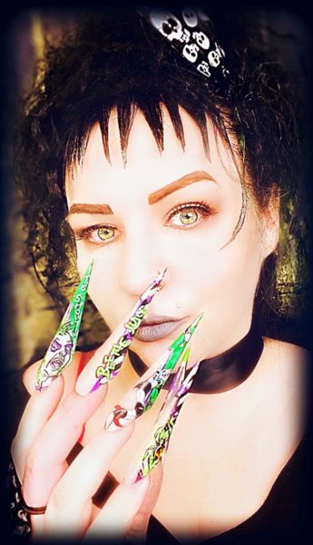 Sarah Kay Abbott
"This entry is all about me. It’s my favourite movie of all time and also I done all my own hair, makeup and photoshoot. I really feel this represents who I am and the things I love, long nails, freehand nail art, makeup and movie. Plus Lydia Deetz is my favourite character so I had to be here."