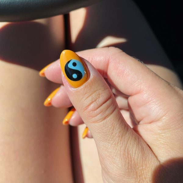 A standout Yin Yang feature nail by @alyssanailtech