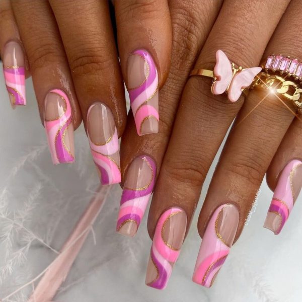 Melbourne nail pro, @claw_queen, takes inspiration from @ntd.melbourne for this abstract pink and gold swirl style.