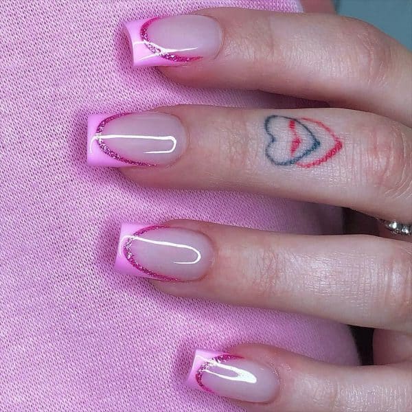 @glammertized puts a Barbie spin on the French manicure, with a baby pink hue and hot pink glitter to outline. 