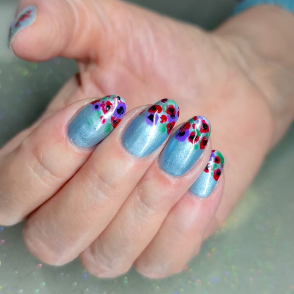 Emma Brock. Purple poppies commemorate and remember animals that have been victims of war.