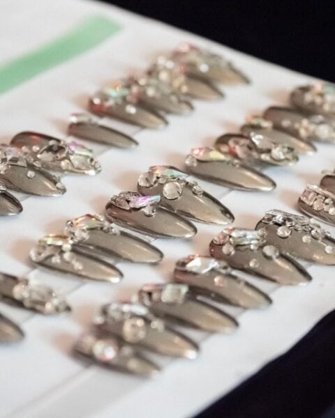 The Yukie Natori salon team was behind silver and gold chrome nails for Bronx and Banco's show, which also featured sparkly embellishments. Image: @yukiebeautyspa