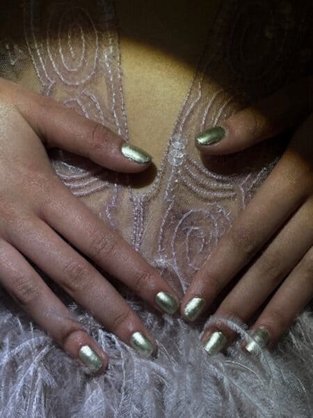 Nails for 16Arlington, led by Sylvie Macmillan using CND™, available via sweetsquared.com. Sylvie comments: “We wanted different opacities and finishes for contrast, and kept nails short for a rock and roll look. We opted for All Frothed Up because the sheerness tied in well with the sheer garments, combined with the subtle hint of mint. Brimstone is the ultimate beige, so looks great on everyone and brings the full coverage opaqueness. For metallics, we picked Divine Diamond, which also reflects the mint tones, and Powerful Hematite which is so jewel-like”.