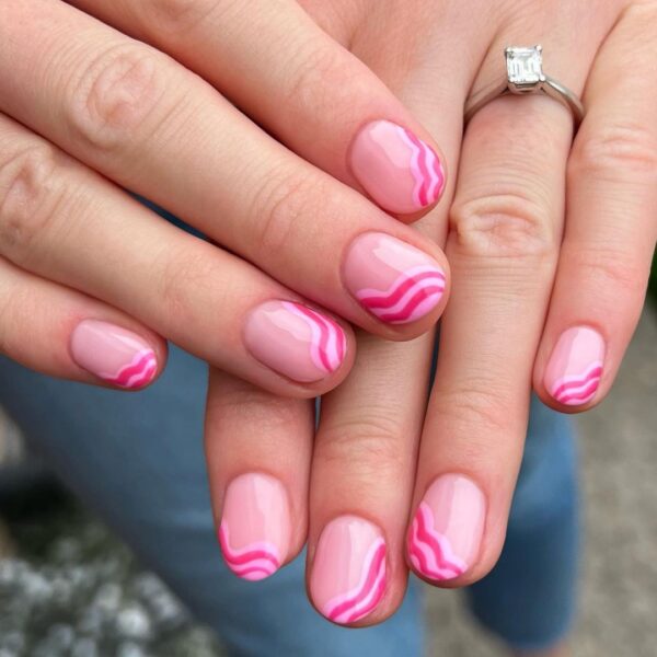 West Midlands business, @checkmynails.__, paints waves of pink across tips in this cute nail look.