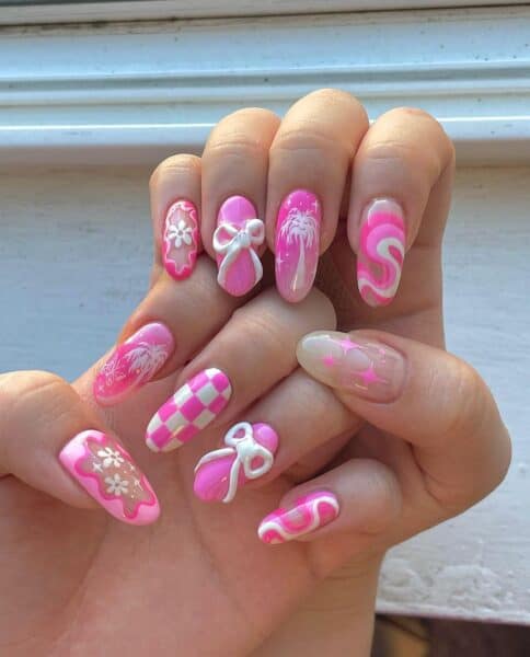 Noelle Moore of @noellefuyunails' jam-packed, Barbiecore mix and match manicure is a feast for the eyes.