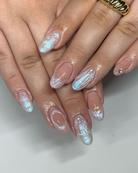 Gisselle Ramos of home salon, @prettyinpolish, fashions pearly French tips and more in this style.