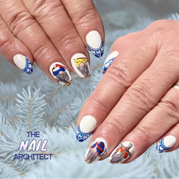 Elysia Harmony - "This client was going on holiday to Delft in the Netherlands. We created a simple Delft pottery French design and included a few quirky gonks, which the Netherlands are known for."