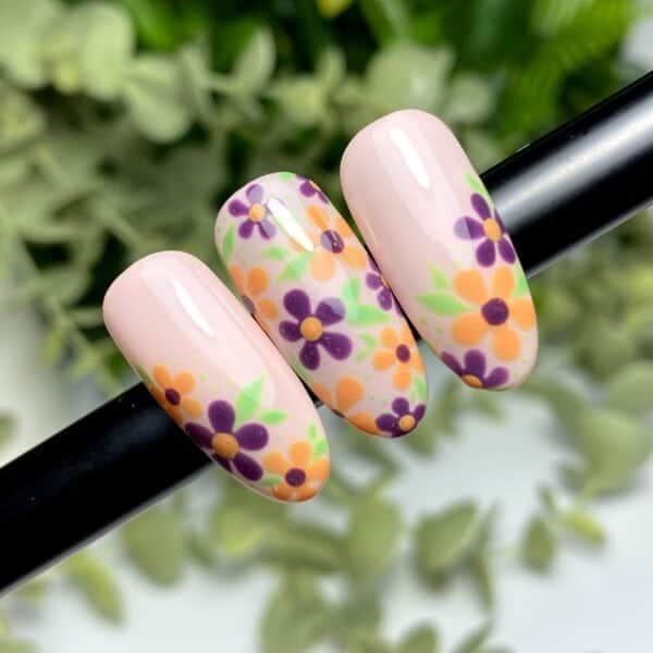 A Floral Nail Style In Secondary Colours