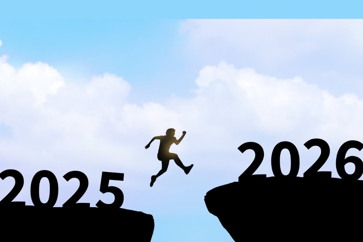 Silhouette of a person leaping across a gap symbolising transition, progress, and overcoming challenges between 2025 and 2026 in the beauty industry.